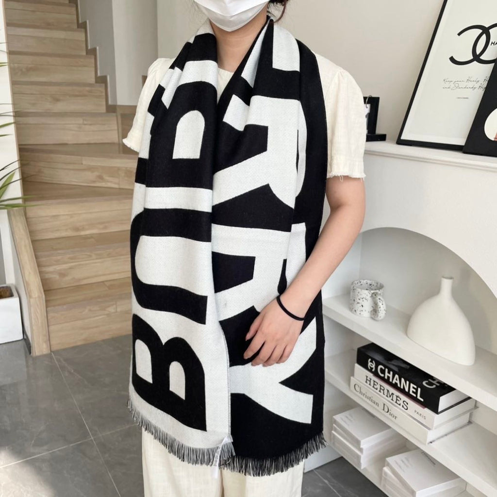 Burberry reversible two-tone wool scarf featuring a circular logo design, crafted from a cotton-wool blend