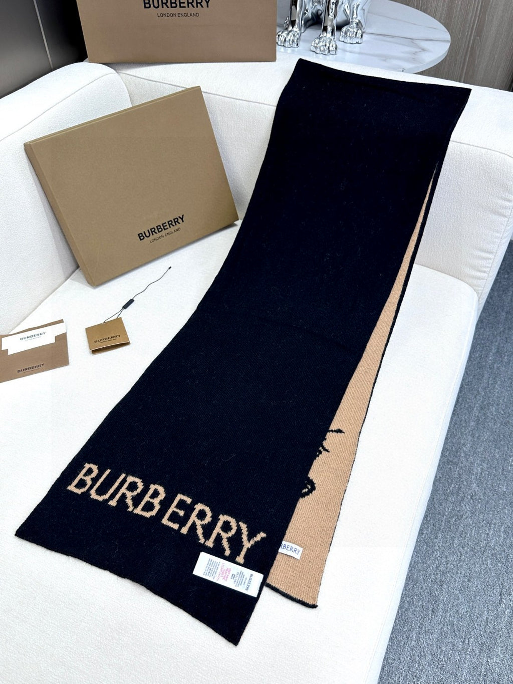 Burberry reversible two-tone wool scarf featuring a circular logo design, crafted from a cotton-wool blend