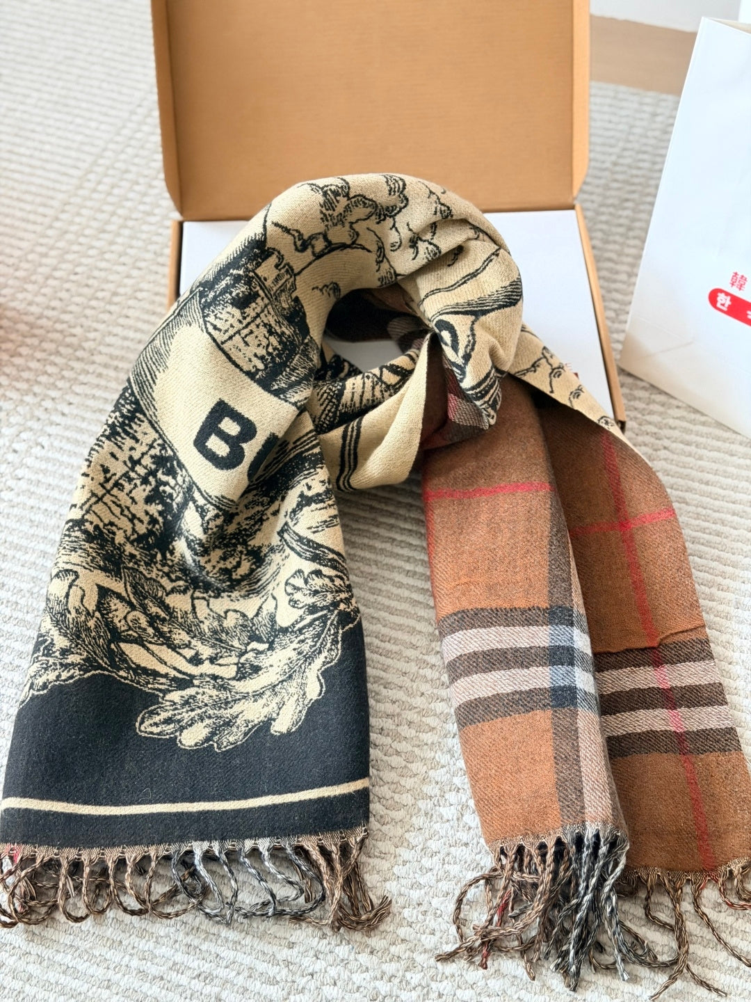 Burberry reversible two-tone wool scarf featuring a circular logo design, crafted from a cotton-wool blend