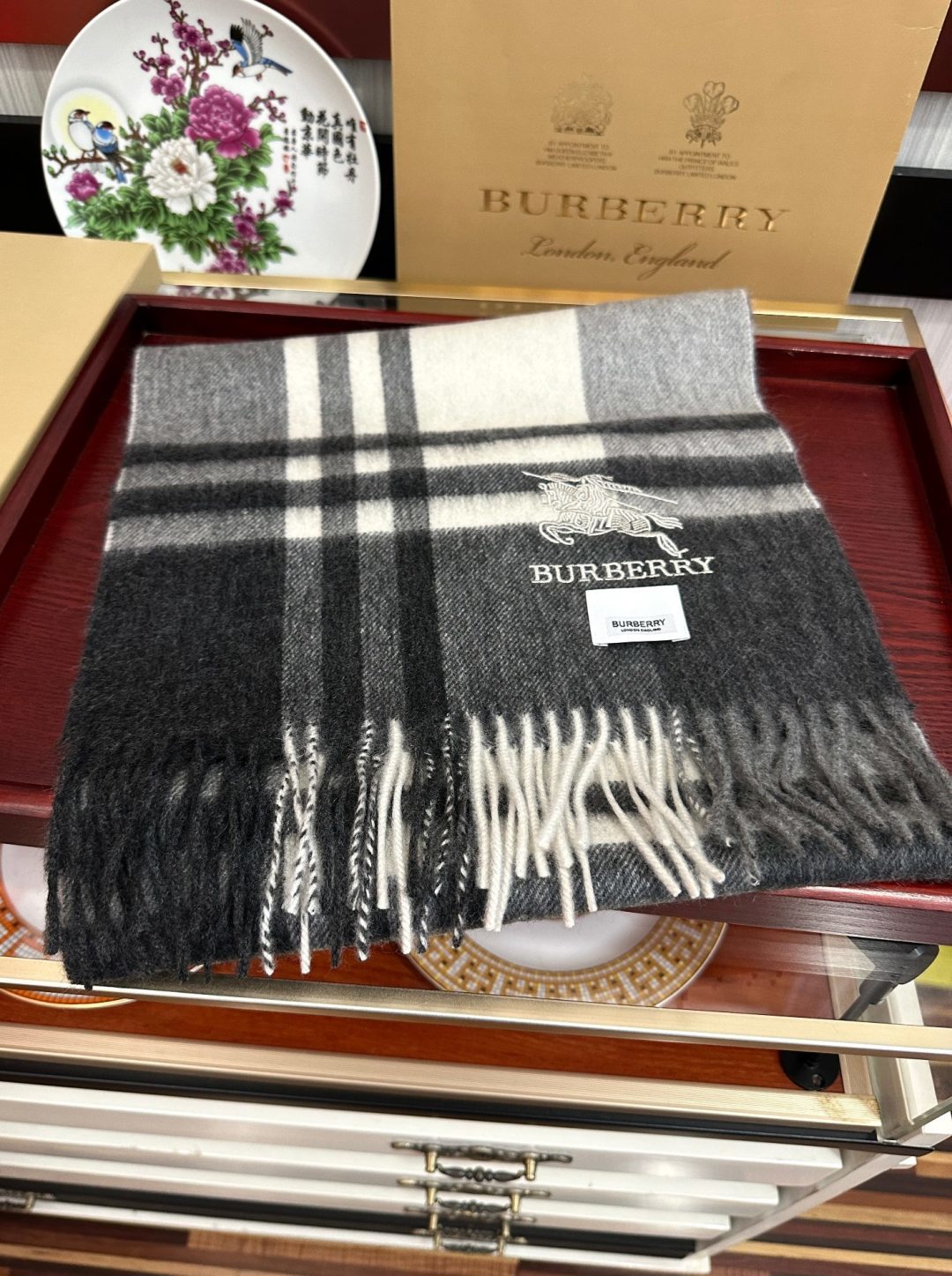 Burberry reversible two-tone wool scarf featuring a circular logo design, crafted from a cotton-wool blend