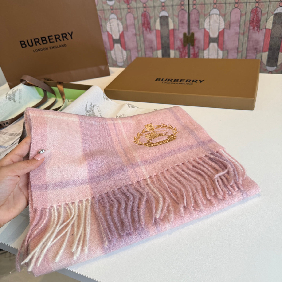 Burberry reversible two-tone wool scarf featuring a circular logo design, crafted from a cotton-wool blend