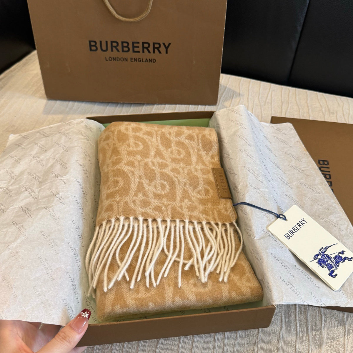 Burberry reversible two-tone wool scarf featuring a circular logo design, crafted from a cotton-wool blend