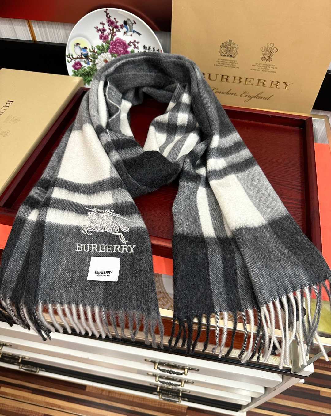 Burberry reversible two-tone wool scarf featuring a circular logo design, crafted from a cotton-wool blend