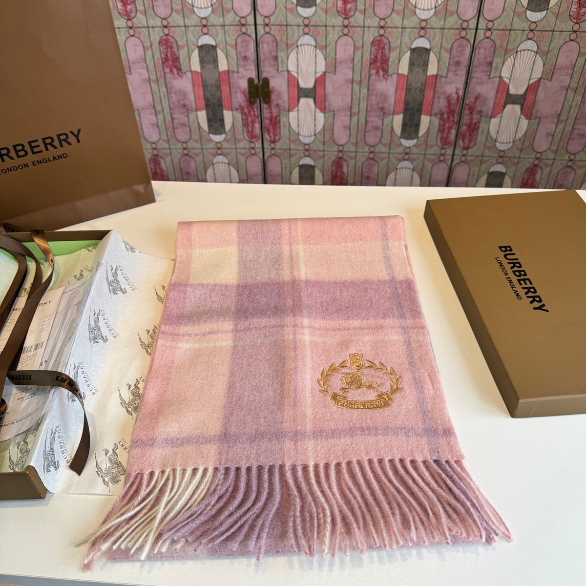 Burberry reversible two-tone wool scarf featuring a circular logo design, crafted from a cotton-wool blend