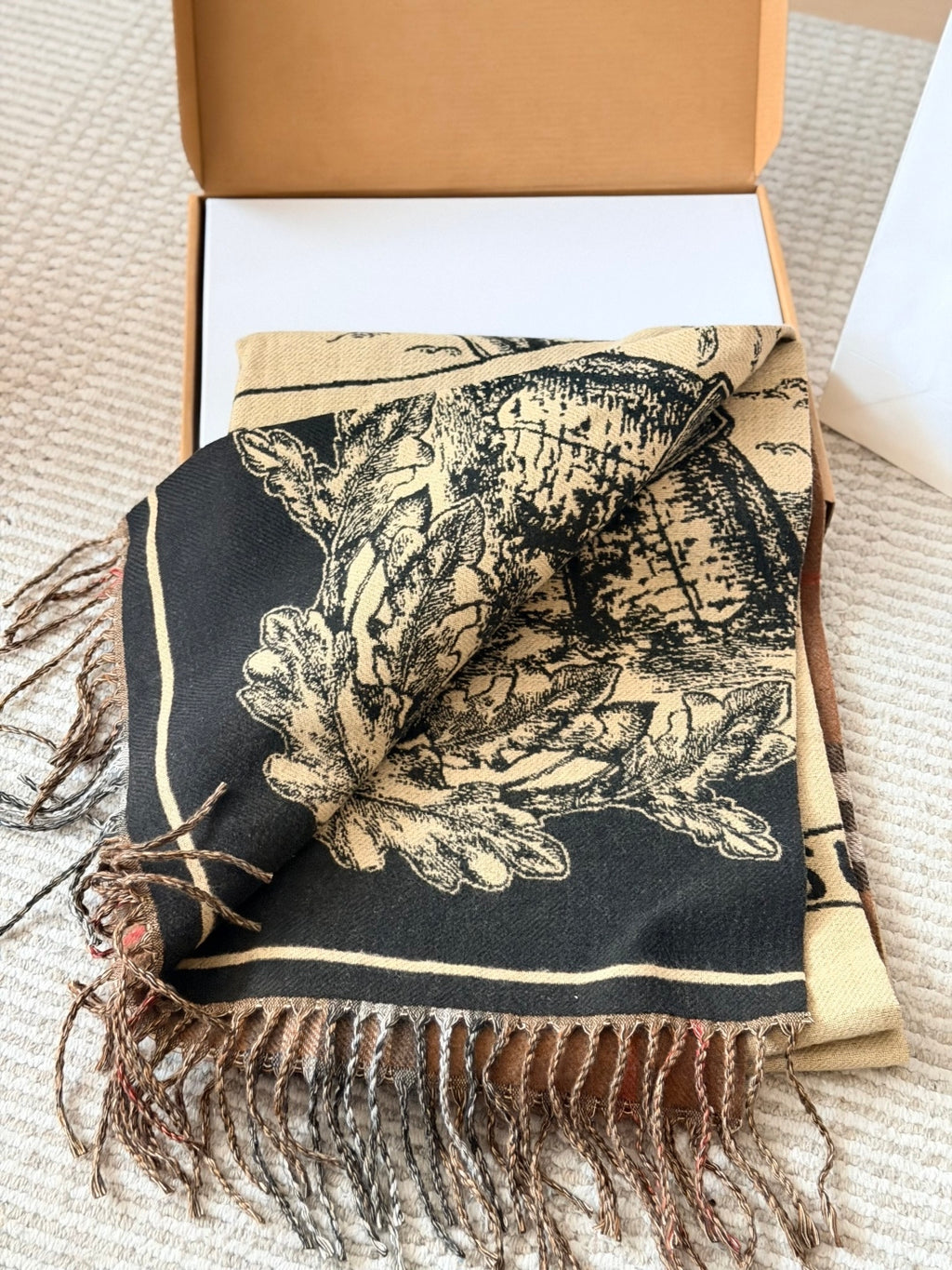 Burberry reversible two-tone wool scarf featuring a circular logo design, crafted from a cotton-wool blend