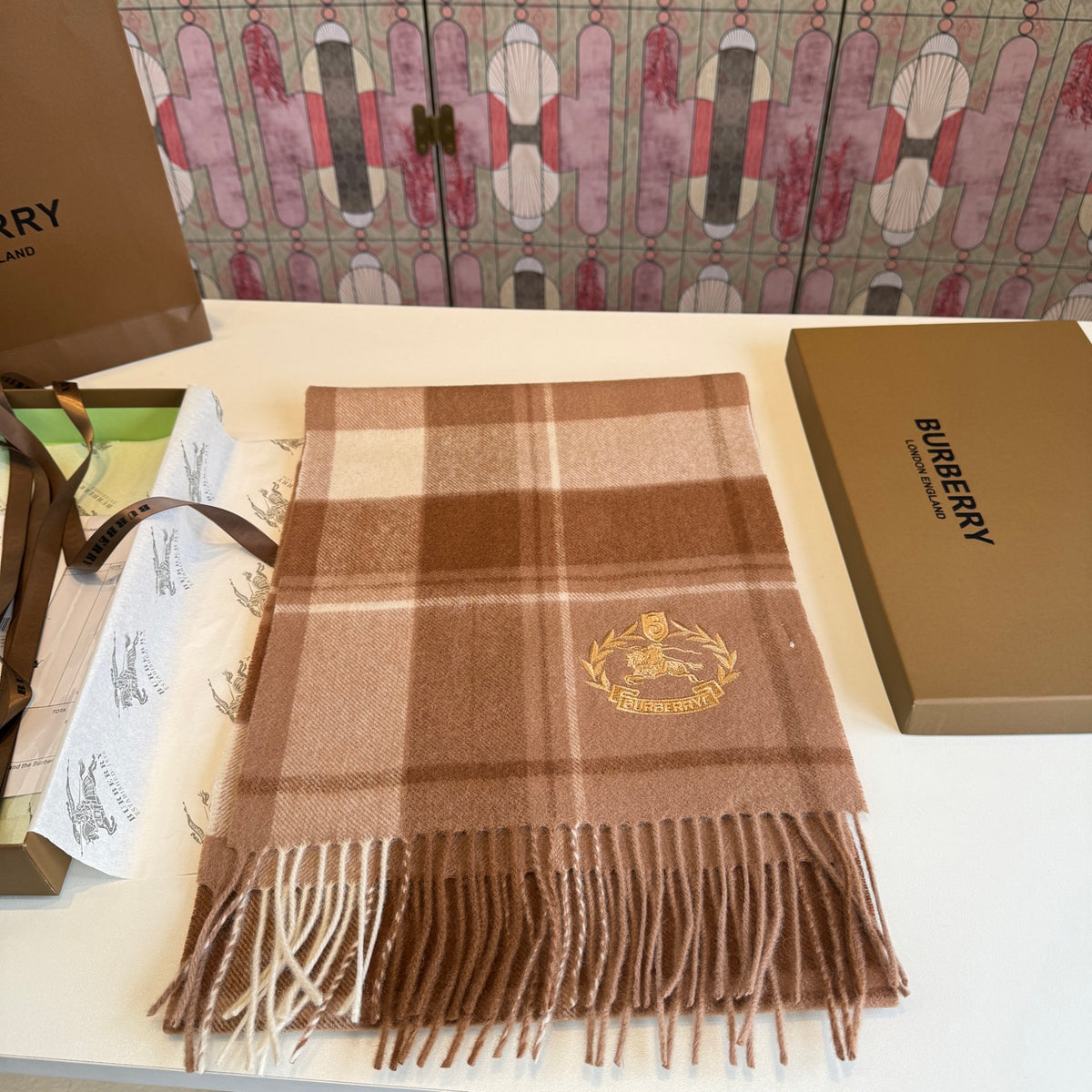 Burberry reversible two-tone wool scarf featuring a circular logo design, crafted from a cotton-wool blend