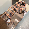 Burberry reversible two-tone wool scarf featuring a circular logo design, crafted from a cotton-wool blend