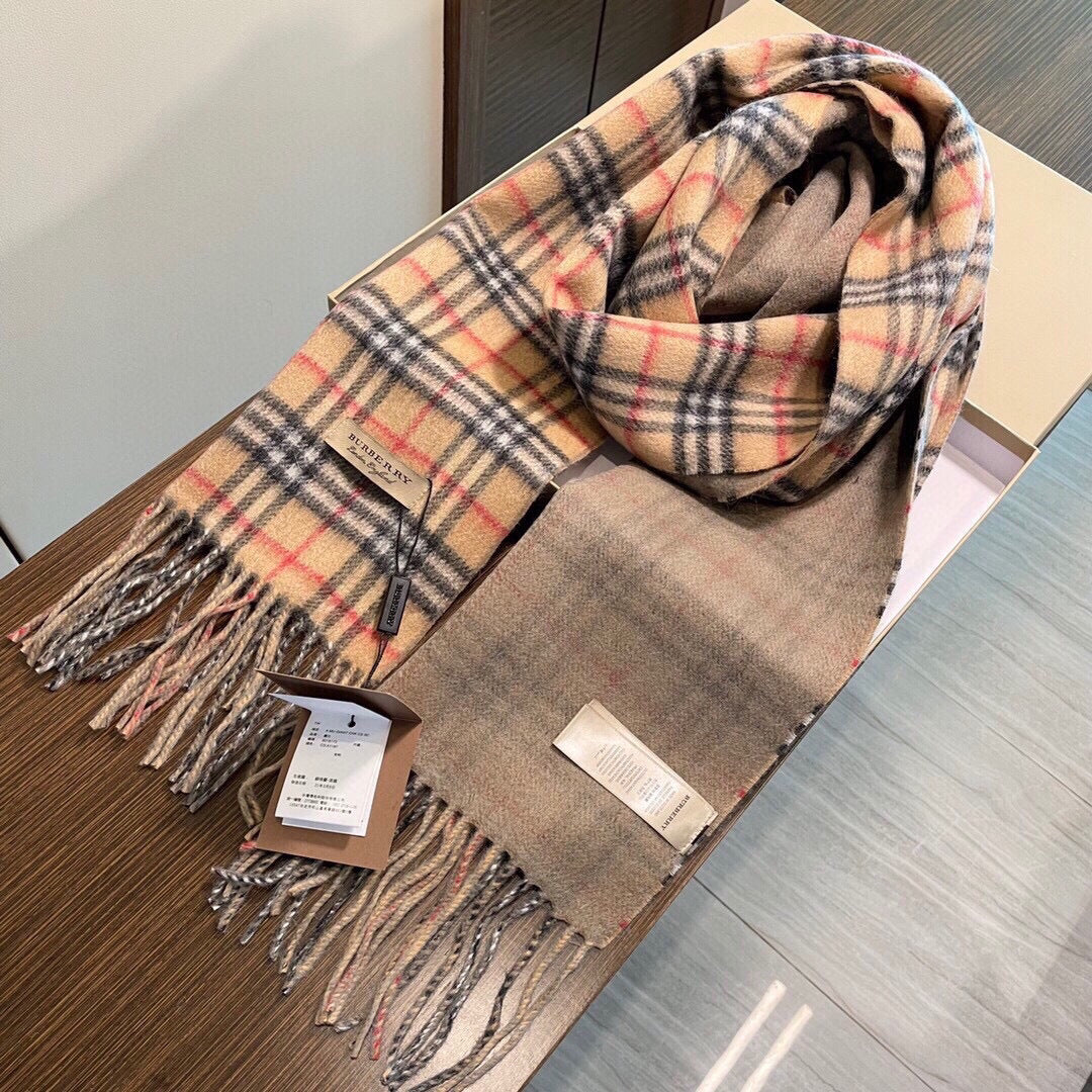 Burberry reversible two-tone wool scarf featuring a circular logo design, crafted from a cotton-wool blend