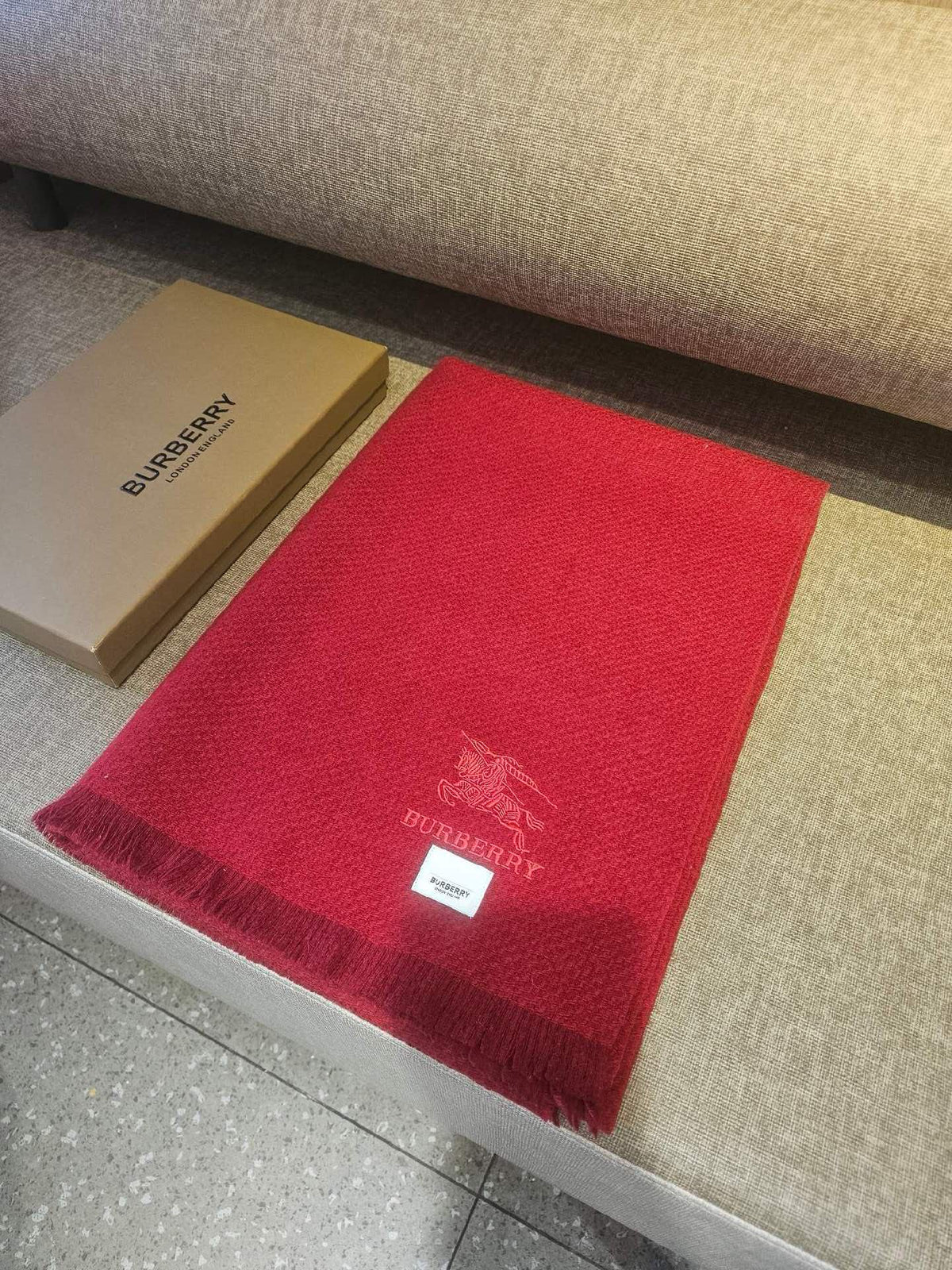 Burberry reversible two-tone wool scarf featuring a circular logo design, crafted from a cotton-wool blend