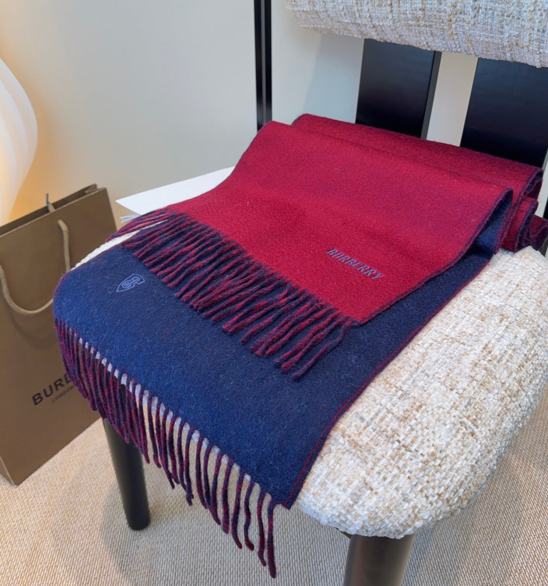 Burberry reversible two-tone wool scarf featuring a circular logo design, crafted from a cotton-wool blend