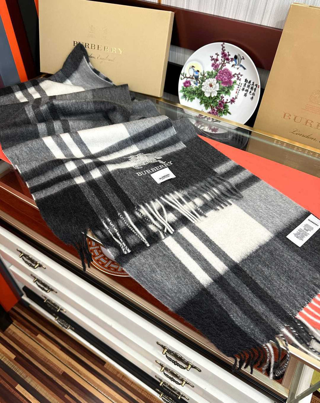 Burberry reversible two-tone wool scarf featuring a circular logo design, crafted from a cotton-wool blend