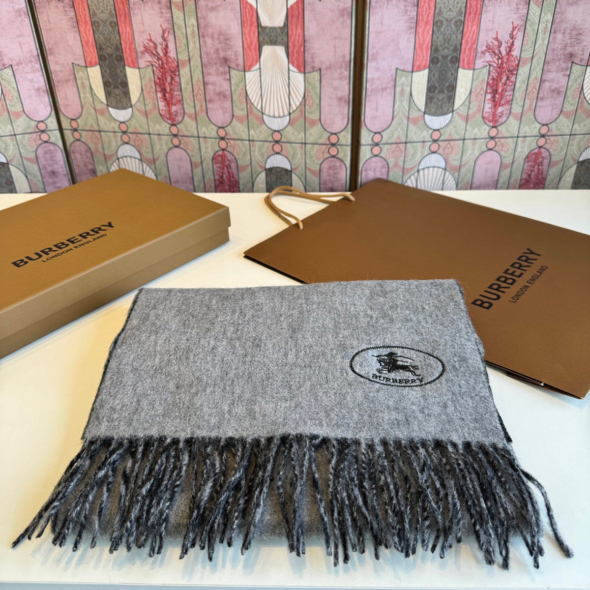 Burberry reversible two-tone wool scarf featuring a circular logo design, crafted from a cotton-wool blend