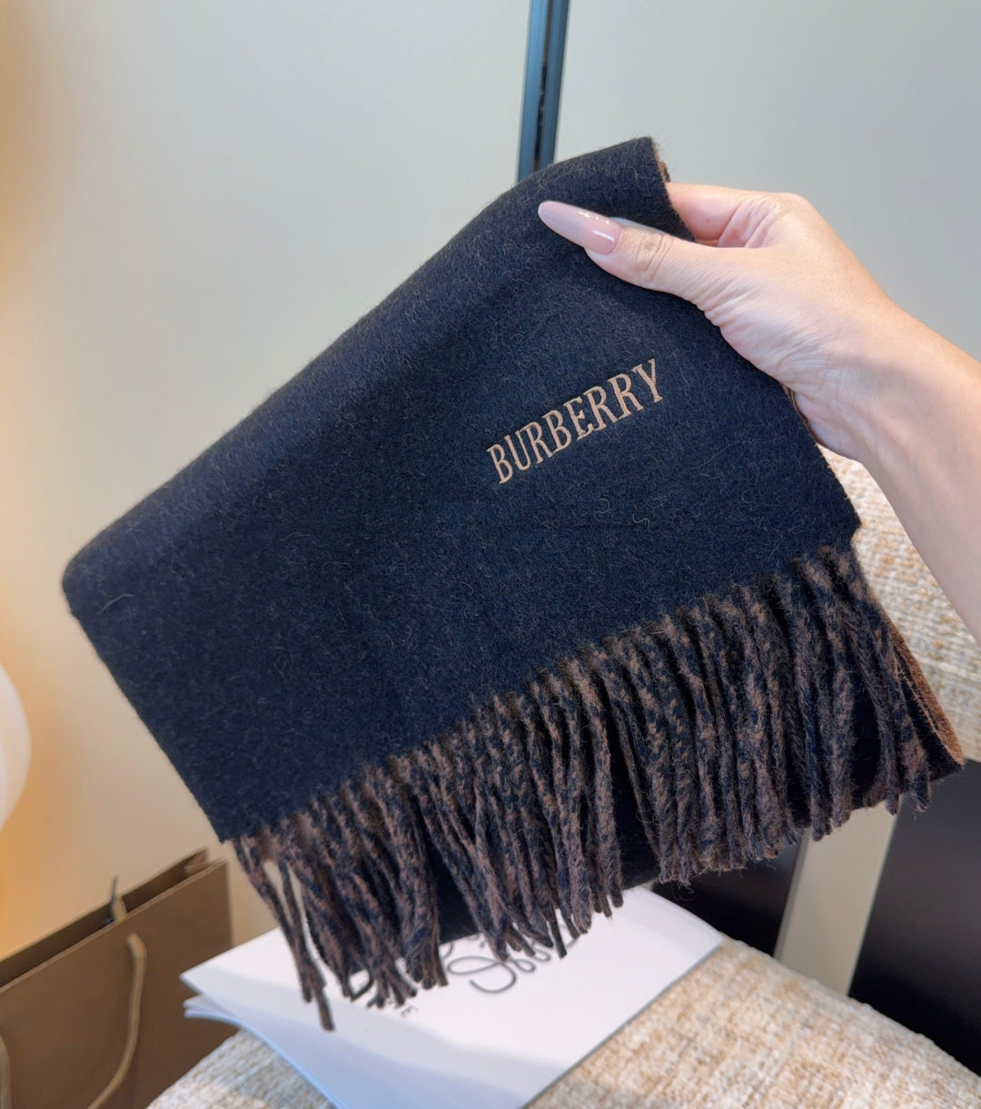 Burberry reversible two-tone wool scarf featuring a circular logo design, crafted from a cotton-wool blend