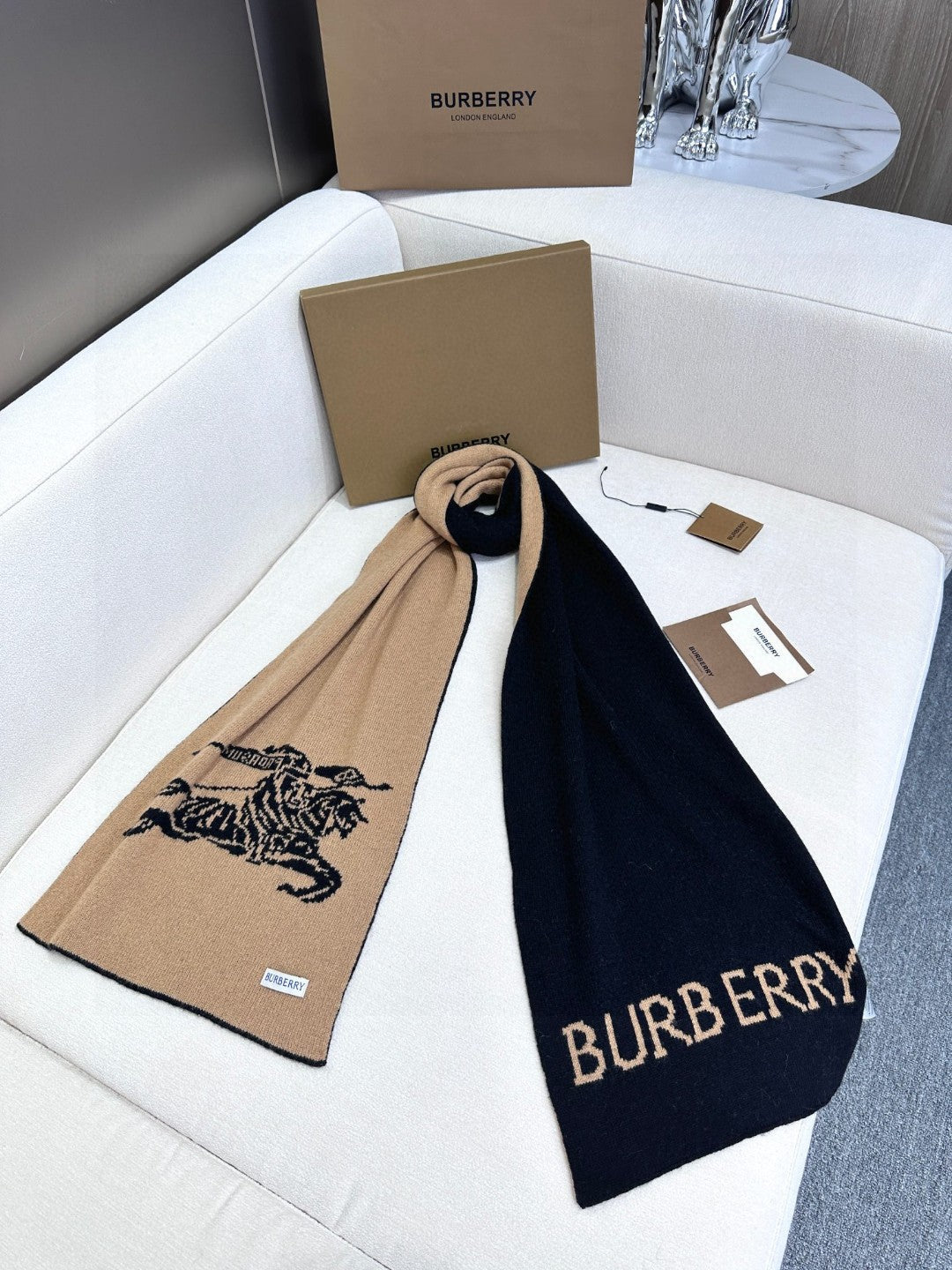 Burberry reversible two-tone wool scarf featuring a circular logo design, crafted from a cotton-wool blend