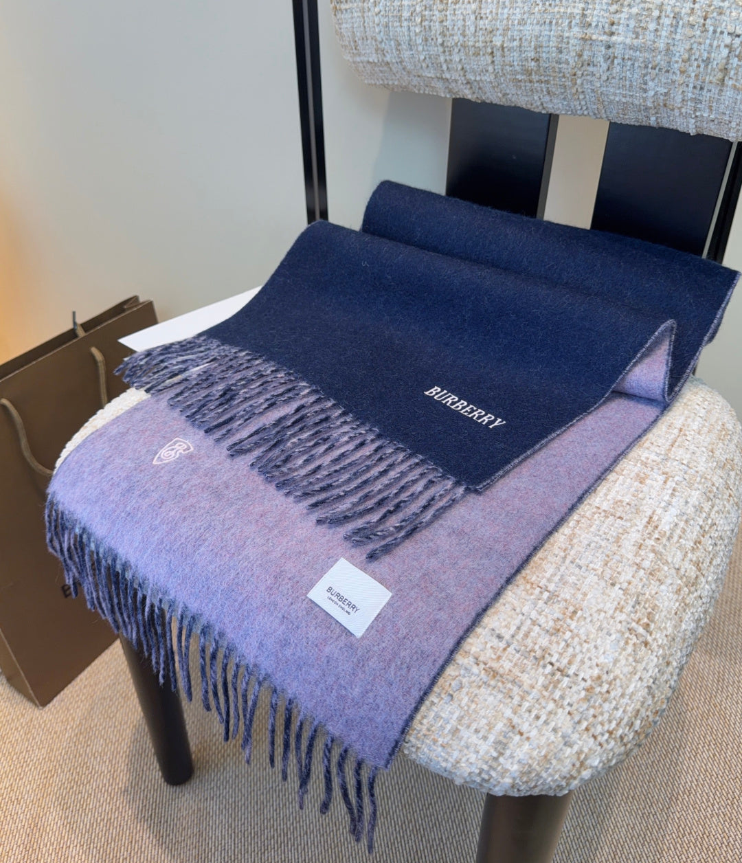 Burberry reversible two-tone wool scarf featuring a circular logo design, crafted from a cotton-wool blend