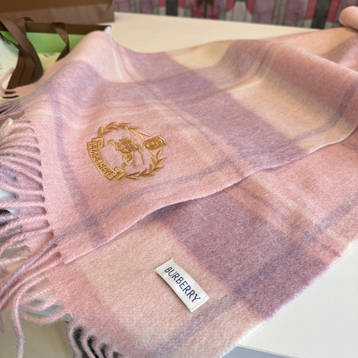 Burberry reversible two-tone wool scarf featuring a circular logo design, crafted from a cotton-wool blend