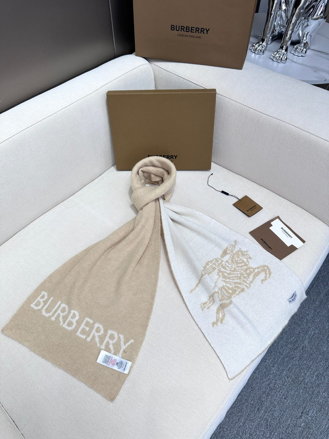 Burberry reversible two-tone wool scarf featuring a circular logo design, crafted from a cotton-wool blend