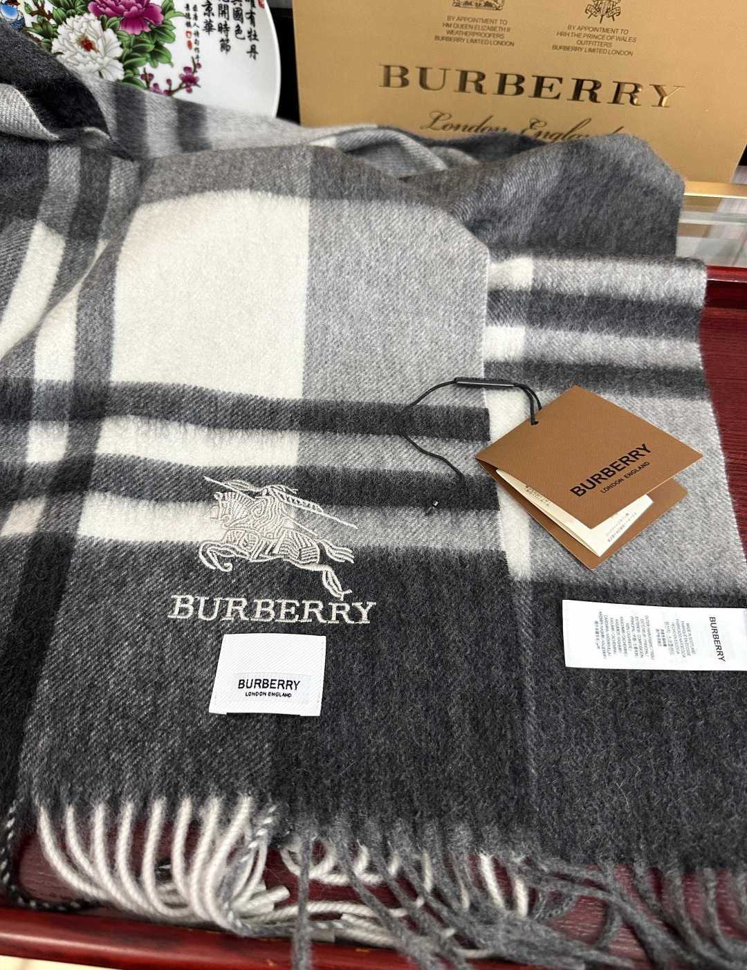 Burberry reversible two-tone wool scarf featuring a circular logo design, crafted from a cotton-wool blend