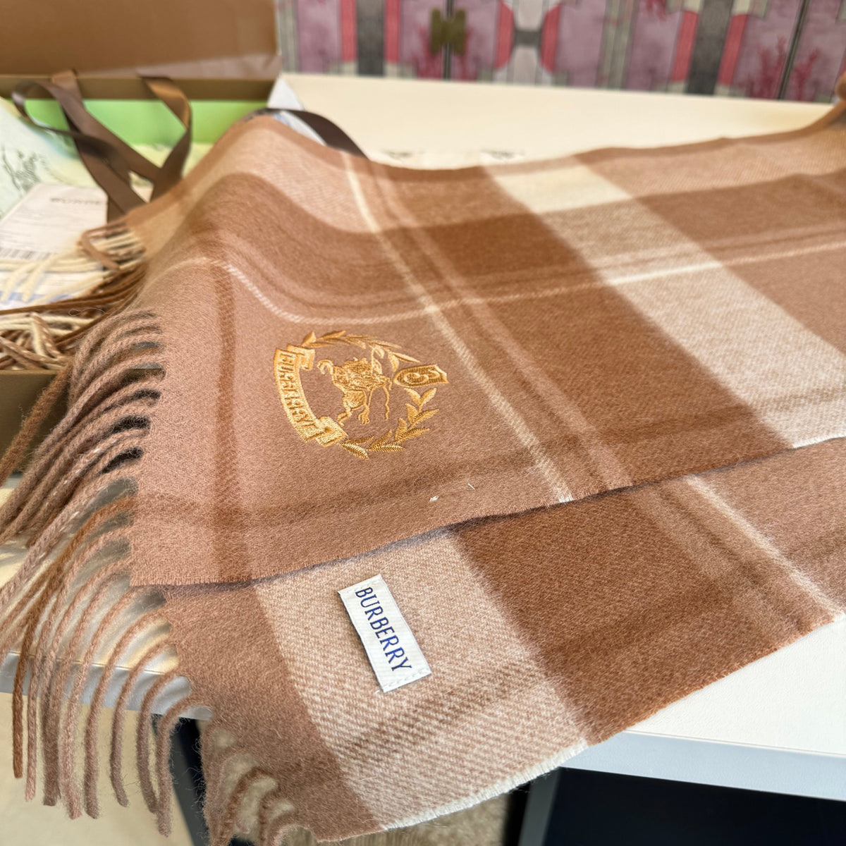 Burberry reversible two-tone wool scarf featuring a circular logo design, crafted from a cotton-wool blend