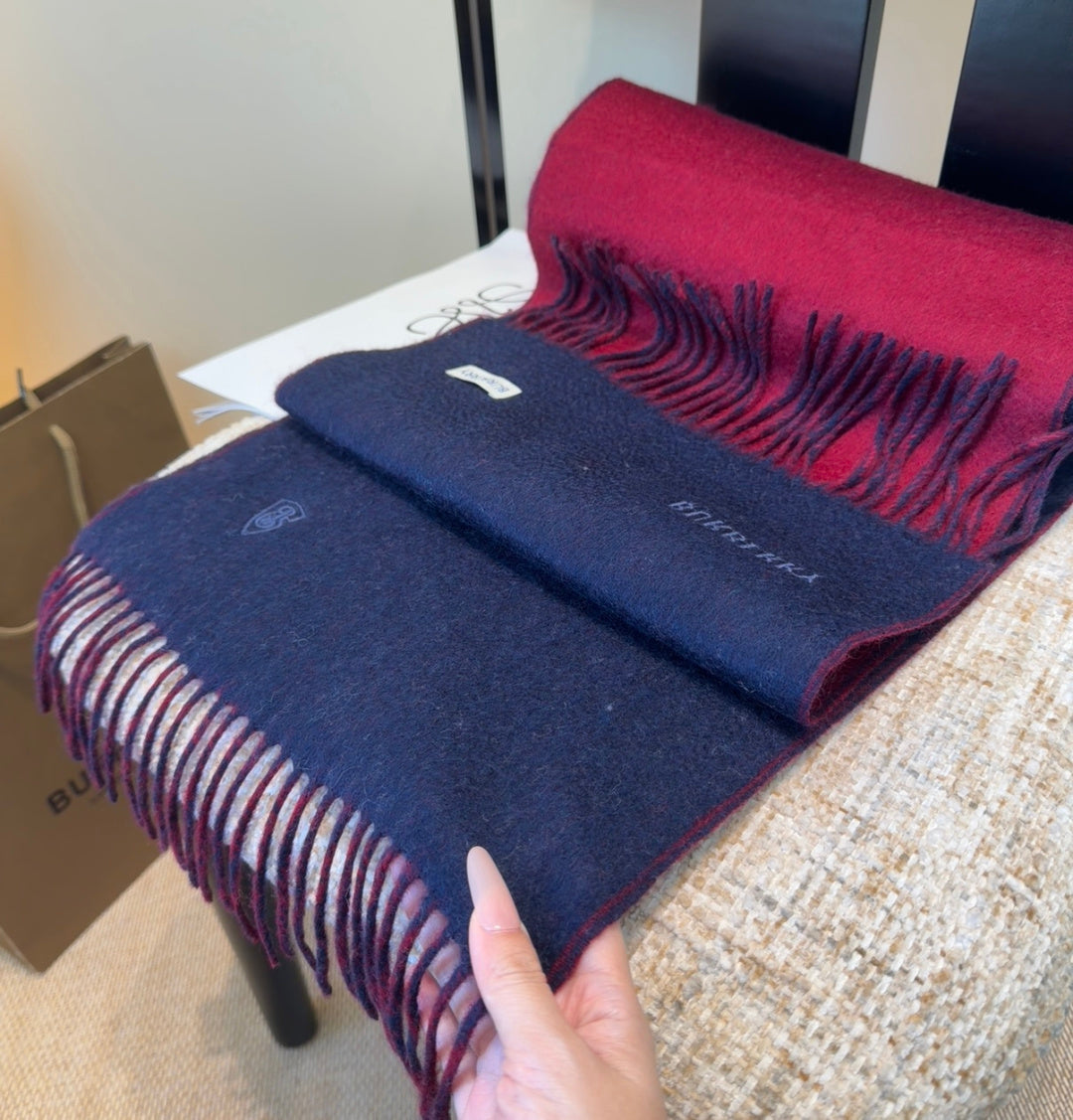 Burberry reversible two-tone wool scarf featuring a circular logo design, crafted from a cotton-wool blend
