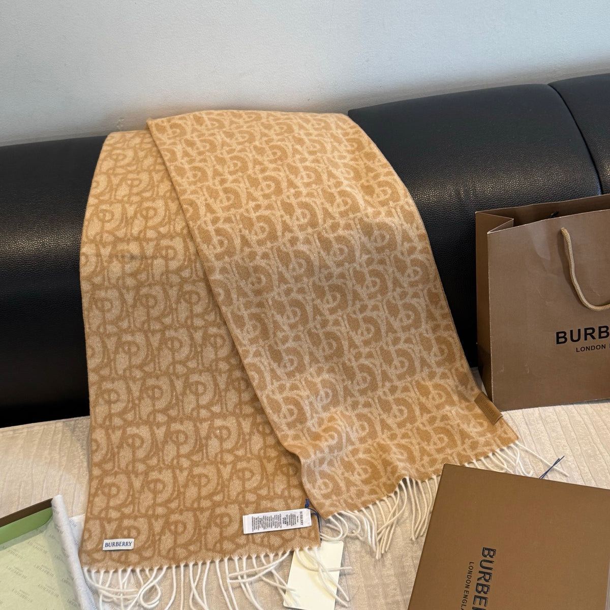Burberry reversible two-tone wool scarf featuring a circular logo design, crafted from a cotton-wool blend