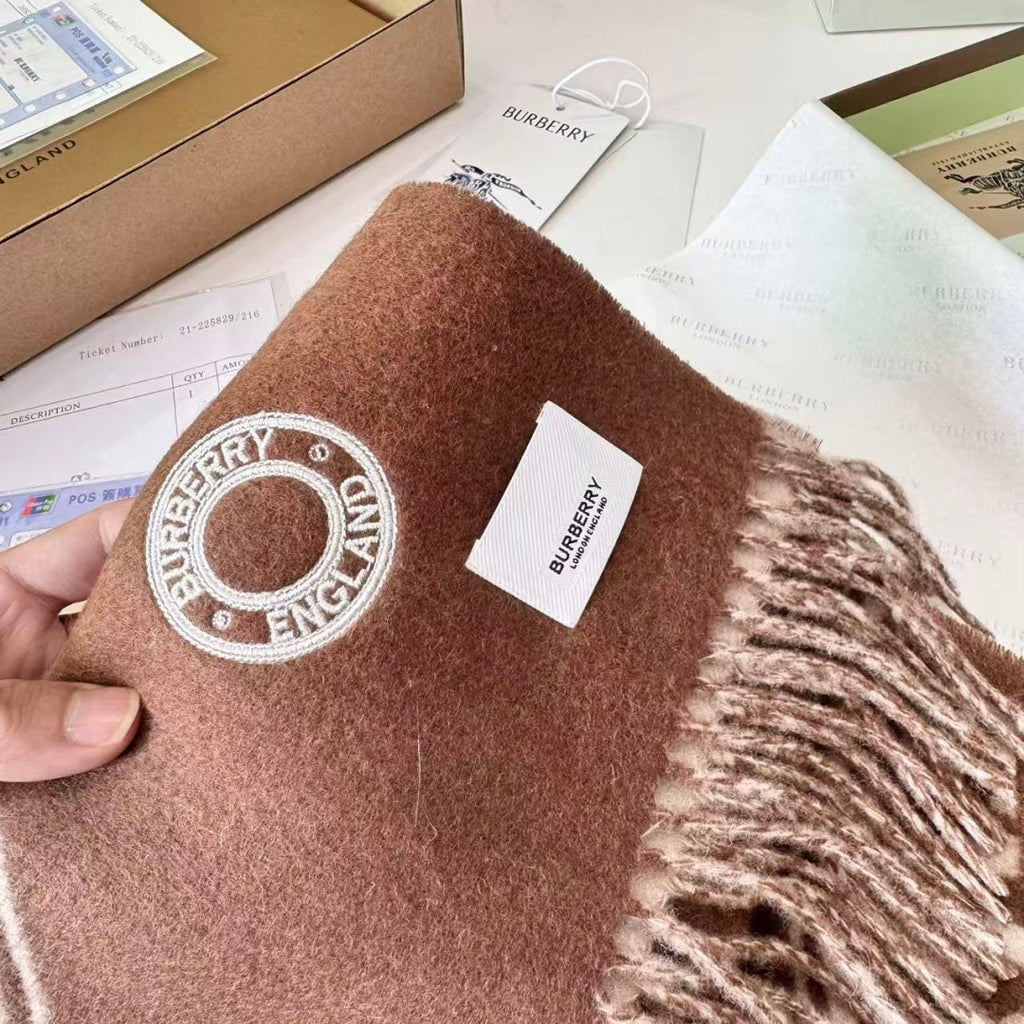 Burberry reversible two-tone wool scarf featuring a circular logo design, crafted from a cotton-wool blend