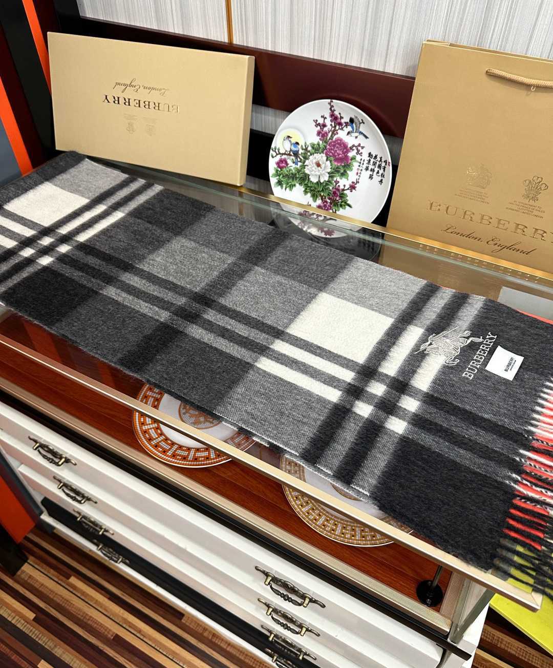 Burberry reversible two-tone wool scarf featuring a circular logo design, crafted from a cotton-wool blend