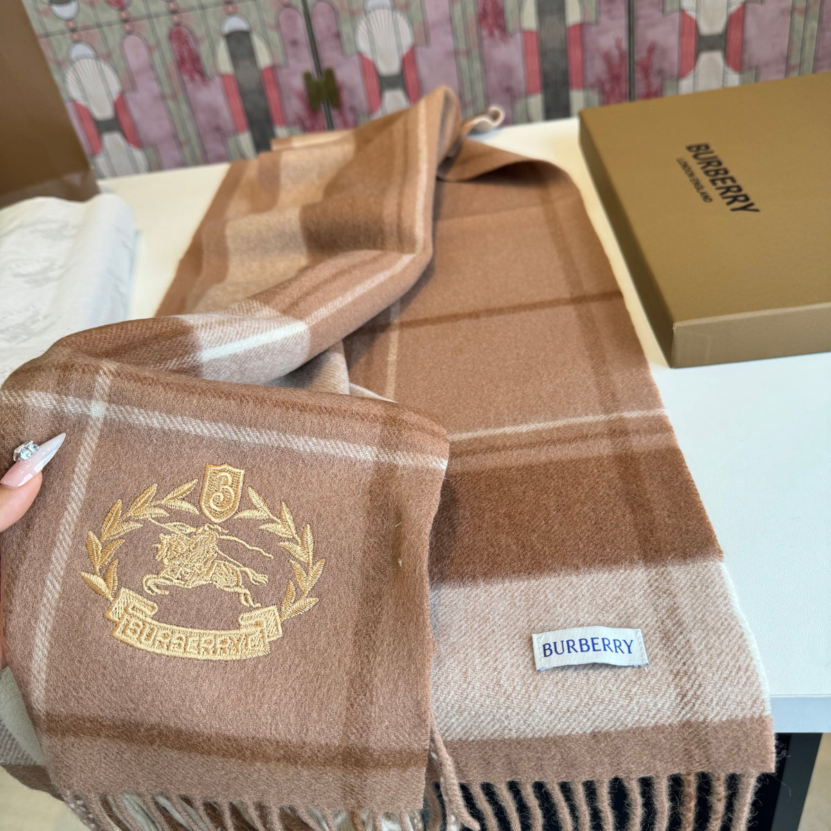Burberry reversible two-tone wool scarf featuring a circular logo design, crafted from a cotton-wool blend