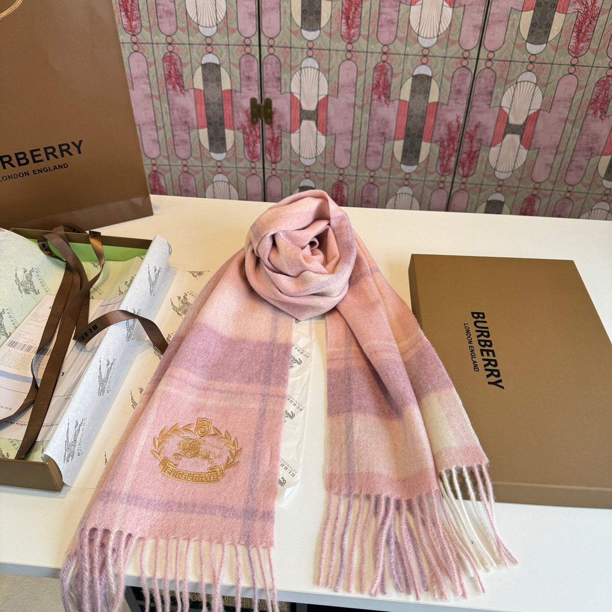 Burberry reversible two-tone wool scarf featuring a circular logo design, crafted from a cotton-wool blend