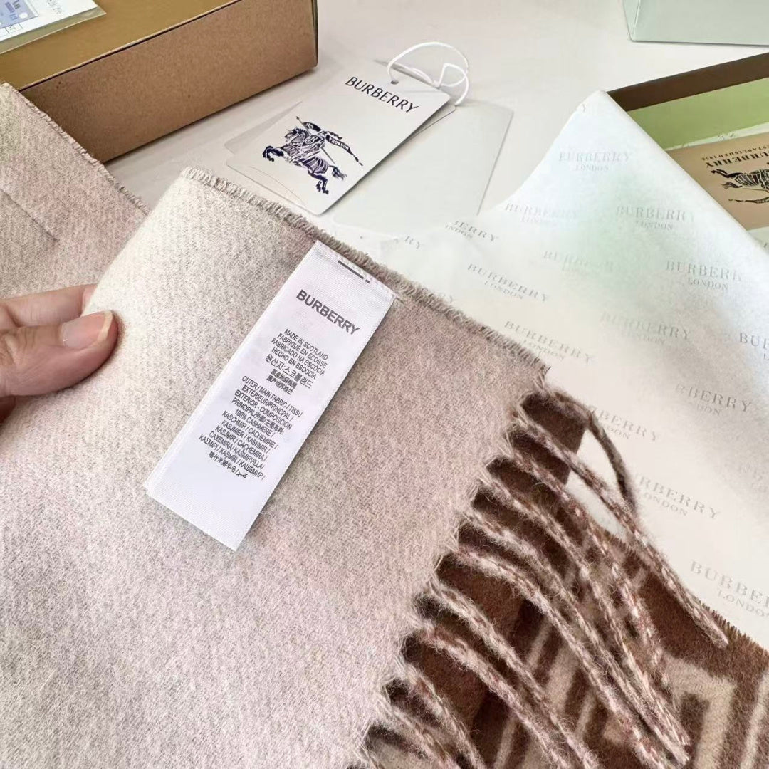 Burberry reversible two-tone wool scarf featuring a circular logo design, crafted from a cotton-wool blend