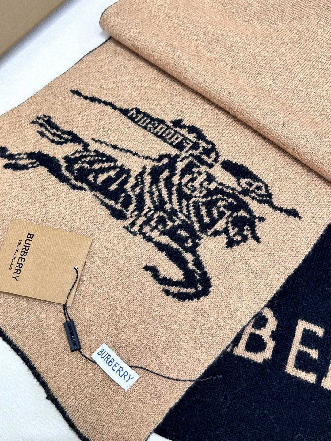 Burberry reversible two-tone wool scarf featuring a circular logo design, crafted from a cotton-wool blend