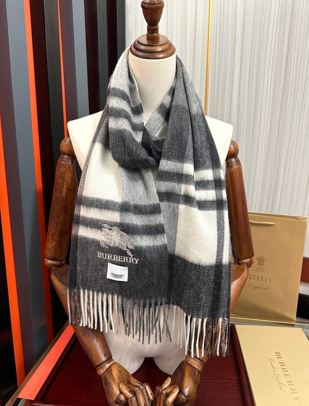 Burberry reversible two-tone wool scarf featuring a circular logo design, crafted from a cotton-wool blend