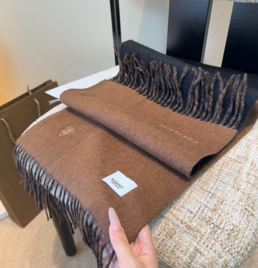 Burberry reversible two-tone wool scarf featuring a circular logo design, crafted from a cotton-wool blend