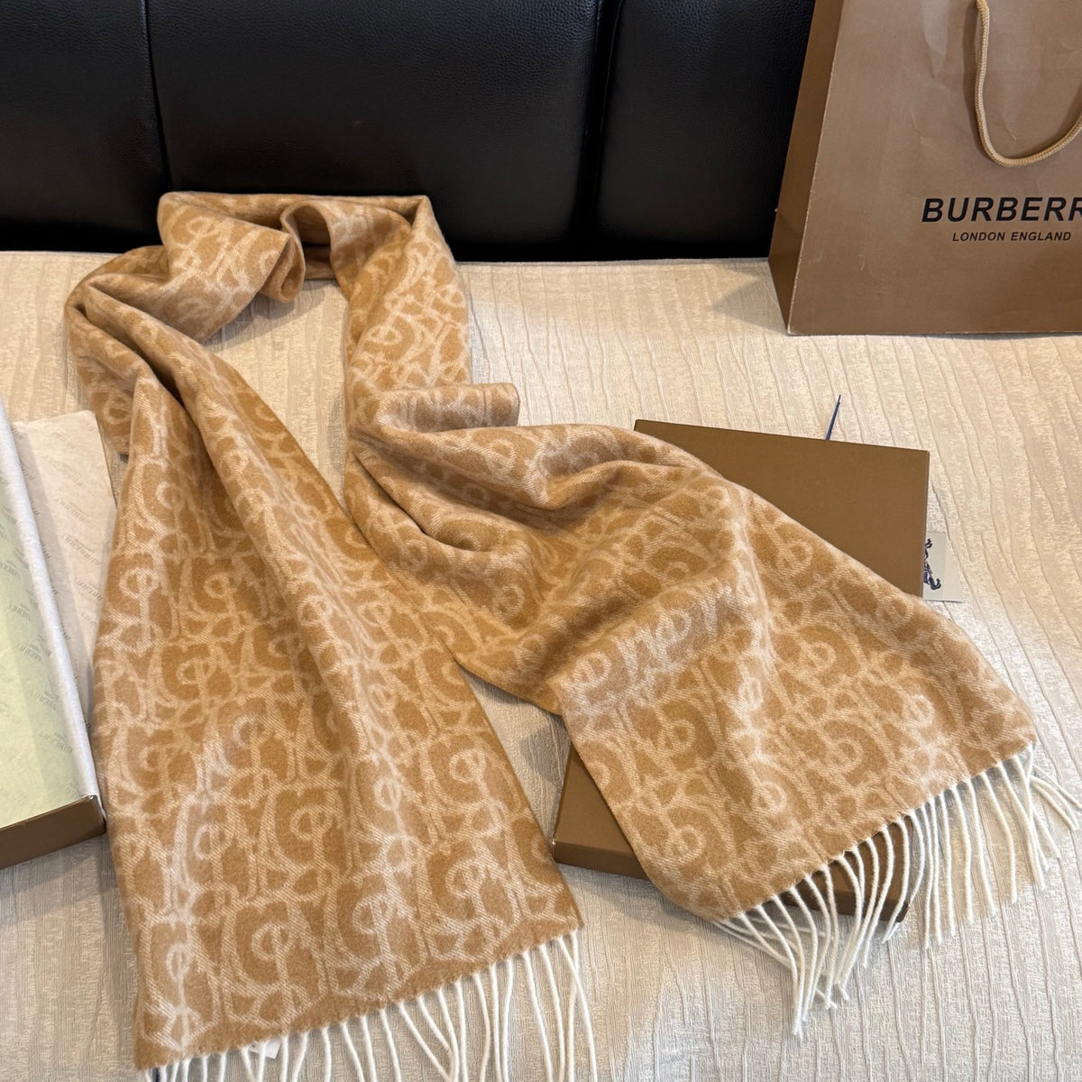 Burberry reversible two-tone wool scarf featuring a circular logo design, crafted from a cotton-wool blend