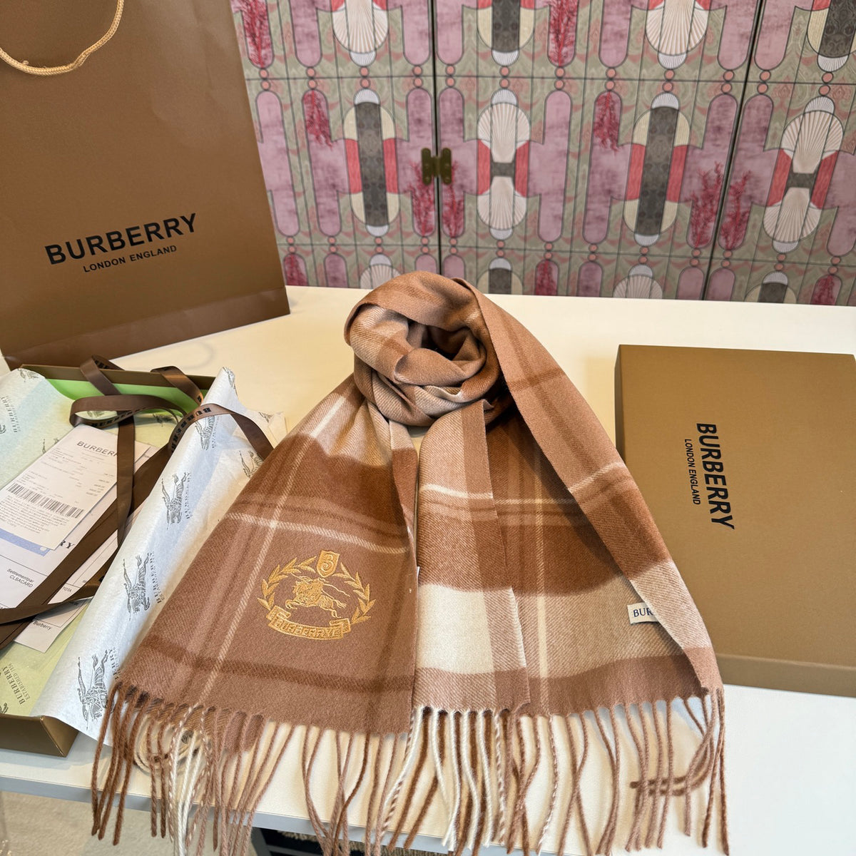 Burberry reversible two-tone wool scarf featuring a circular logo design, crafted from a cotton-wool blend