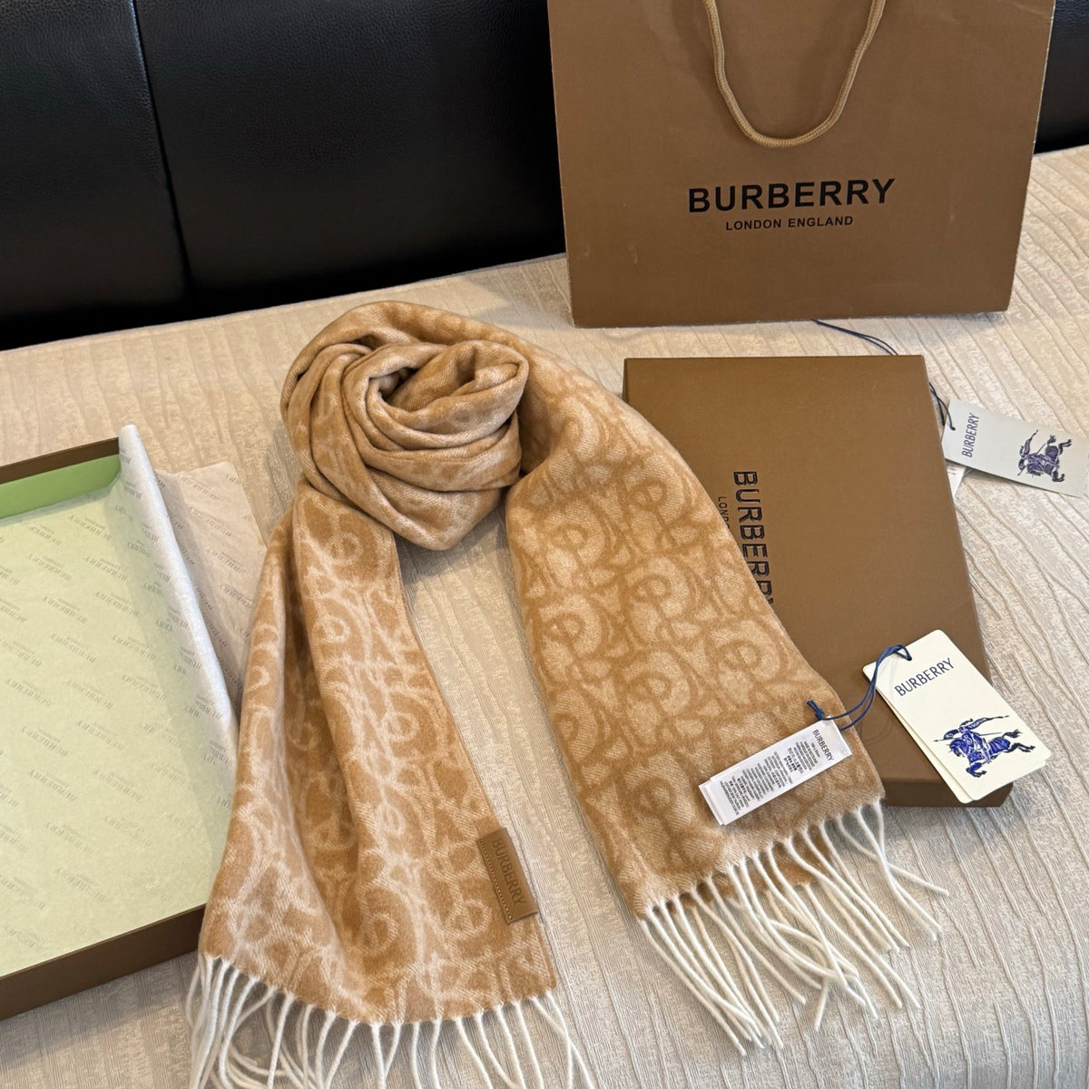 Burberry reversible two-tone wool scarf featuring a circular logo design, crafted from a cotton-wool blend
