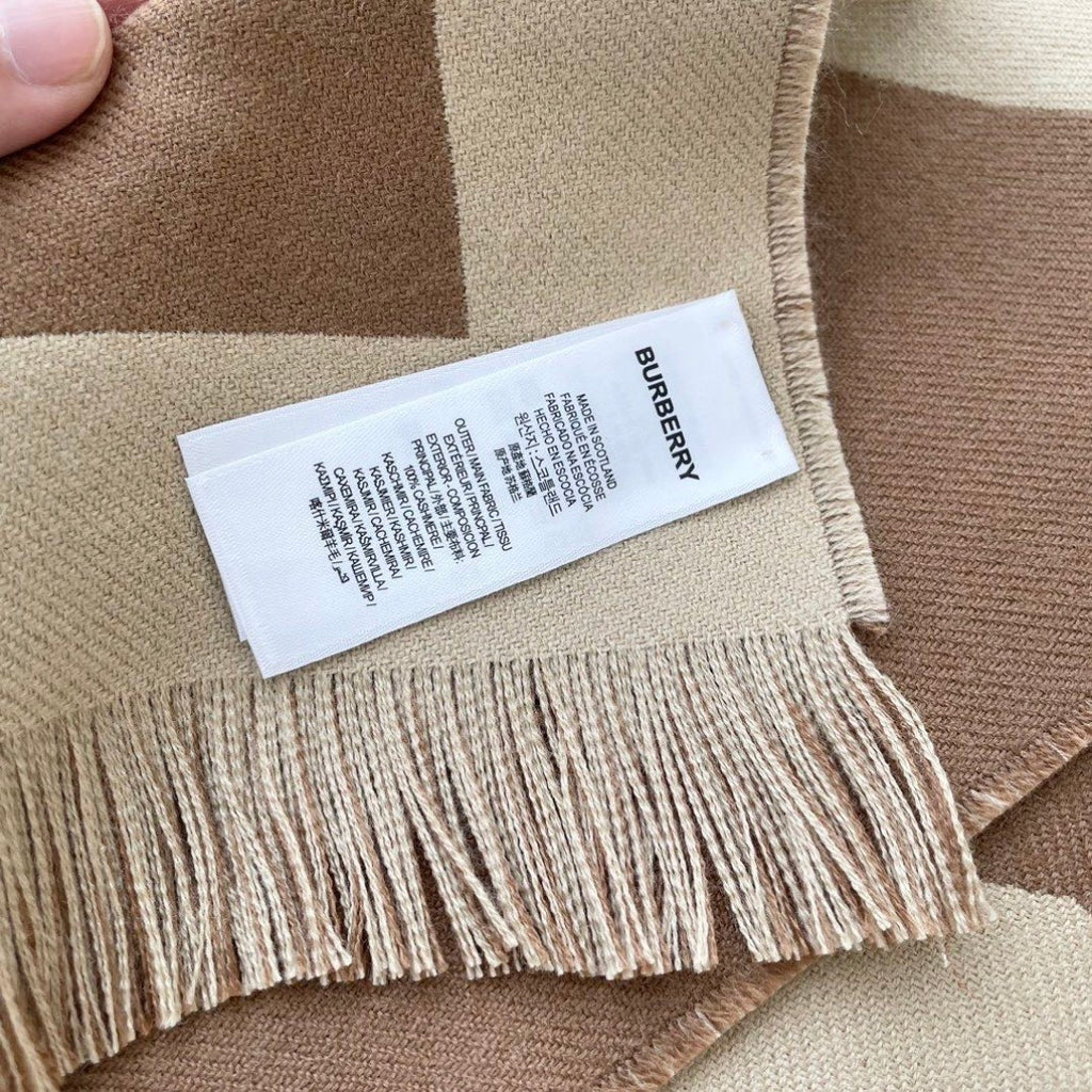 Burberry reversible two-tone wool scarf featuring a circular logo design, crafted from a cotton-wool blend