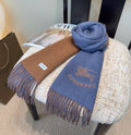 Burberry reversible two-tone wool scarf featuring a circular logo design, crafted from a cotton-wool blend