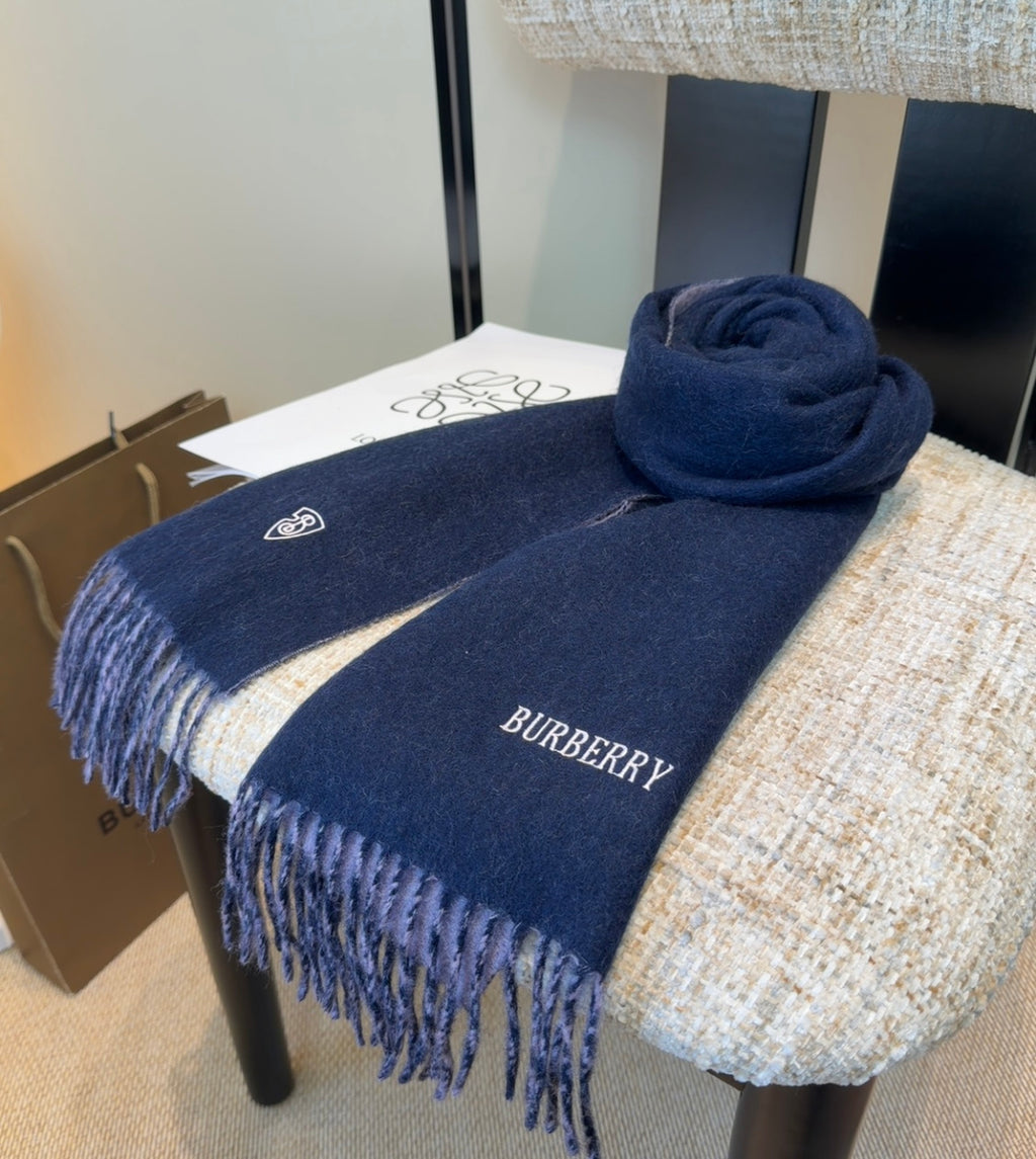 Burberry reversible two-tone wool scarf featuring a circular logo design, crafted from a cotton-wool blend