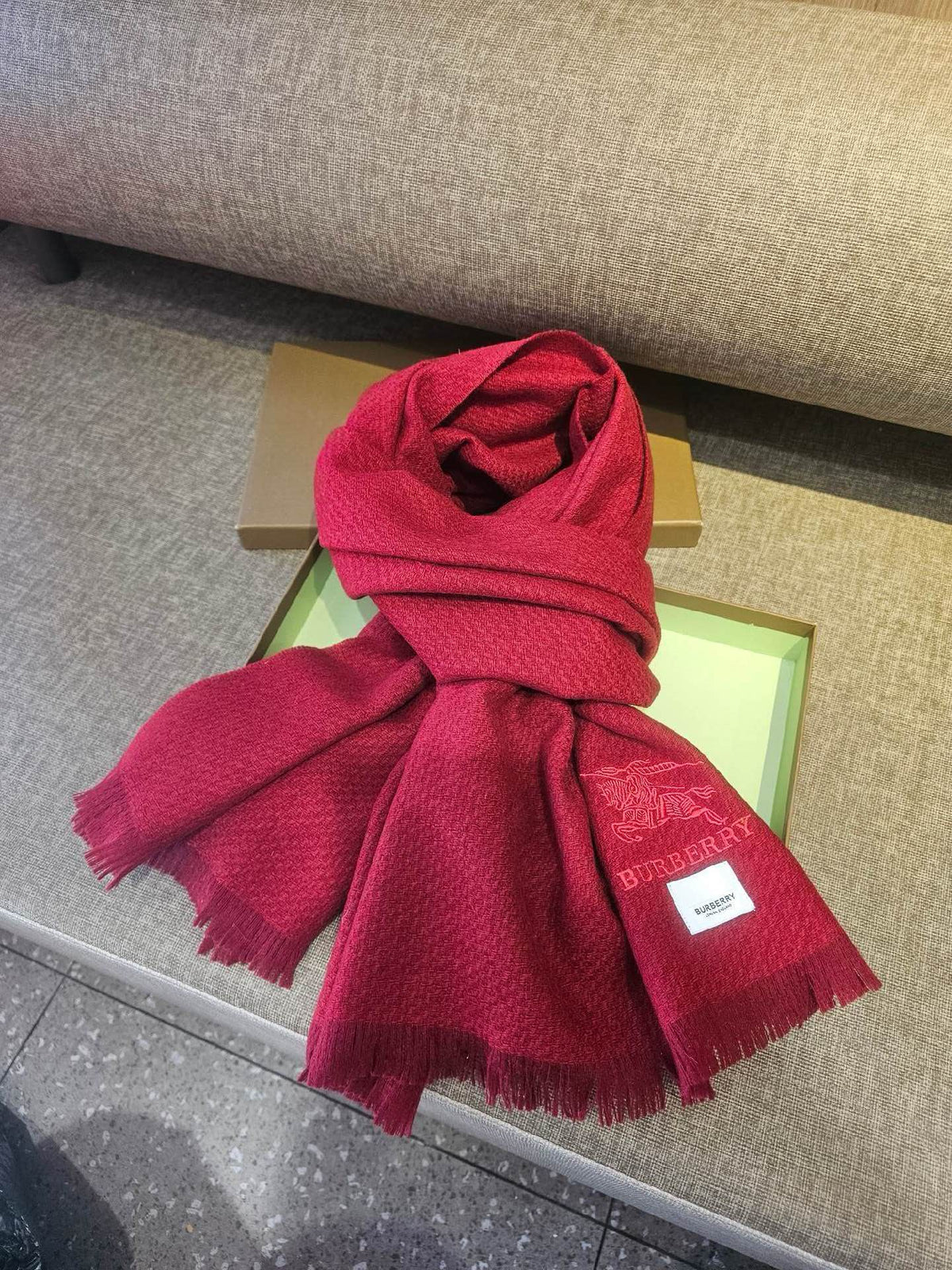 Burberry reversible two-tone wool scarf featuring a circular logo design, crafted from a cotton-wool blend
